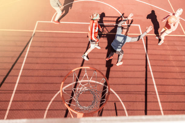 istock Top view of a ball falling into the basket 1060957298
