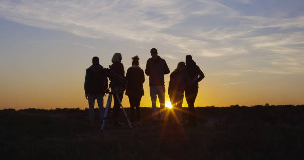 istock Friends together in the setting sun cheering 1060959352