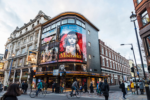 London, United Kingdom - January 4, 2018: Facade of the Queen's Theatre announcing the play Les Miserables in Shaftesbury Avenue, major street in the West End in London, England, United Kingdom