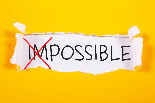 Possible, Motivational Words Quotes Concept Impossible to Possible words letter, written on piece of paper memo. Motivational business typography quotes concept impossible possible stock pictures, royalty-free photos & images