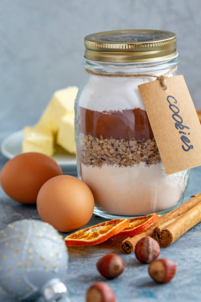 istock Glass jar with ingredients for baking chocolate nut cookies. 1060963578