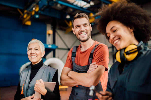 istock Smiling woman with coworkers 1060965170