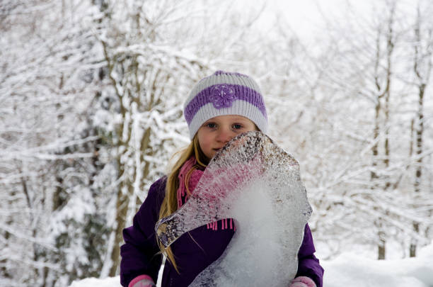 istock child in icy kingdom in winter time 1060965938