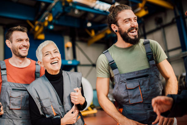 istock Senior woman with young mechanics 1060969728