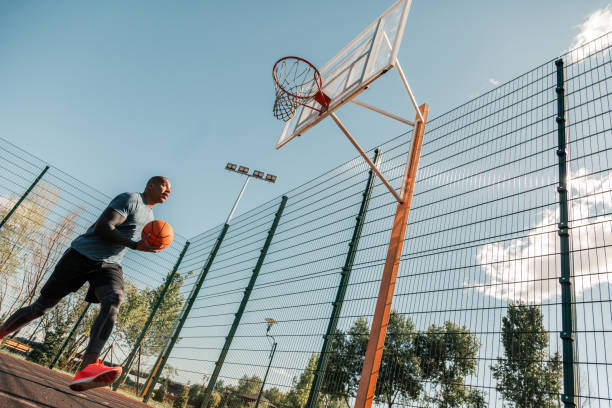 Handsome Afro american man having a basketball training