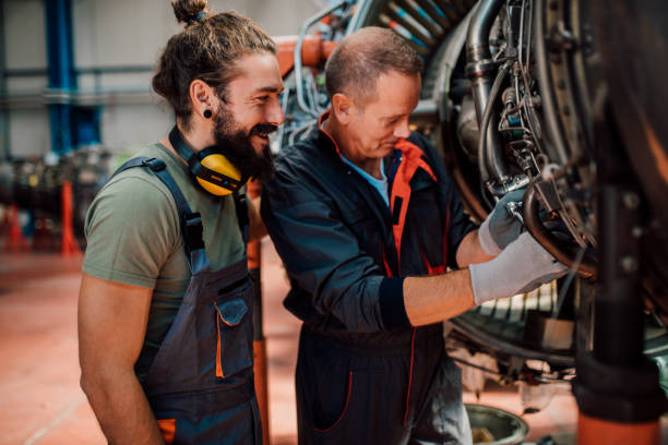 istock Happy men repairing aircraft 1060970012