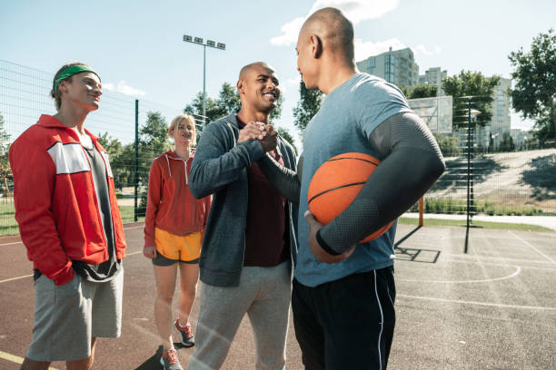 istock Joyful happy man greeting his basketball coach 1060970138
