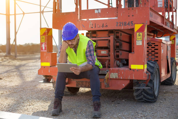 construction worker at building site - building contractor engineer digital tablet construction imagens e fotografias de stock