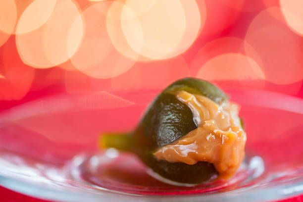 Colombian style fig stuffed with arequipe on a red christmas background