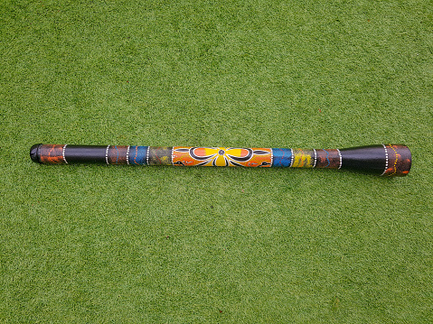 Didgeridoo on a grass.