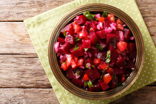 istock Moroccan beetroot salad with onions, tomatoes and herbs close-up. horizontal top view from above 1060982802