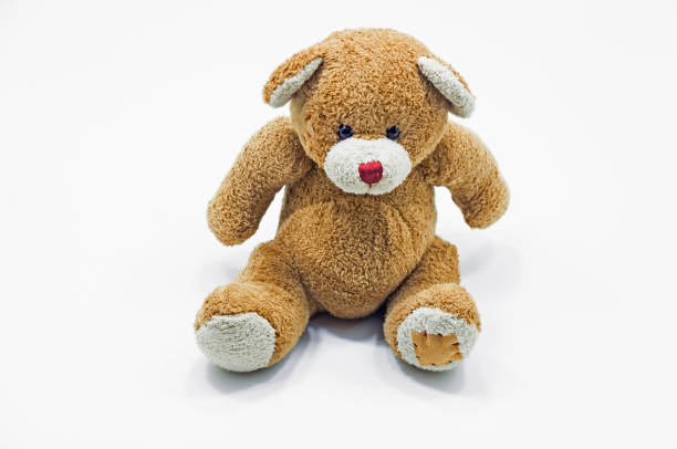 istock Brown Teddy Bear toy sitting on white 1060986094