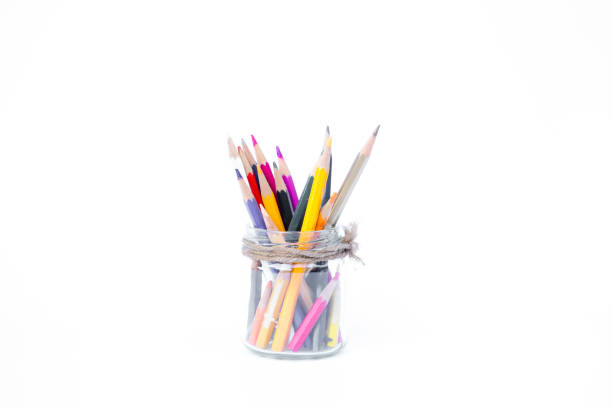 istock Pencils in glass bottles on white background 1060987556