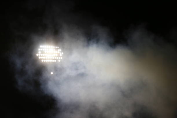 istock Light tower reflectors at a stadium during nightime. 1060991842