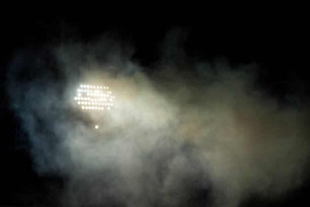 istock Light tower reflectors at a stadium during nightime. 1060992968