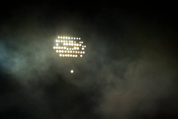 istock Light tower reflectors at a stadium during nightime. 1060994266