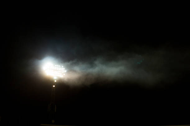 istock Light tower reflectors at a stadium during nightime. 1060994822