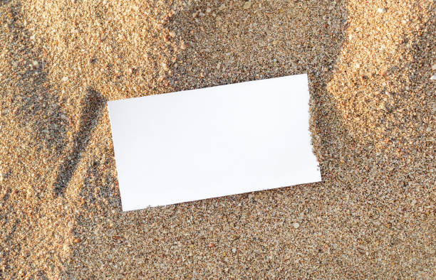 istock Blank card on sand at sea beach. Top view. 1060995602