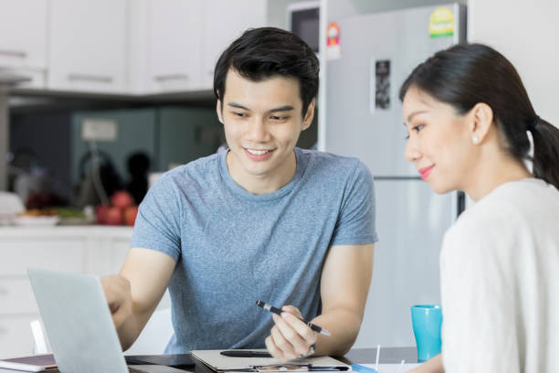 istock Confident couple review home finances 1060995882