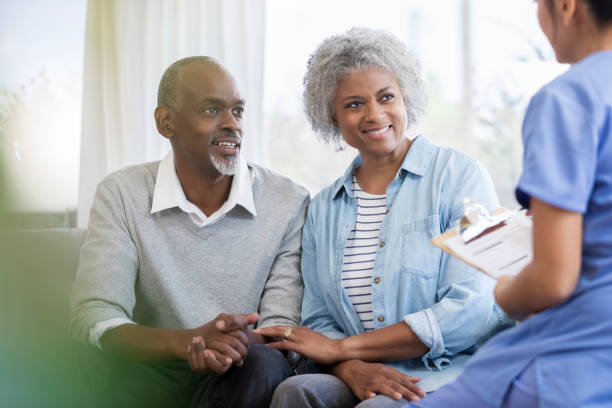 istock Young female nurse talks with senior patients 1060998692