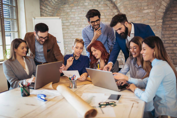 istock Business people working in office together. Team work in office. 1060998832