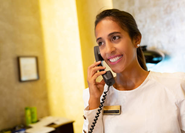 istock Woman working the front desk at a hotel 1061002524