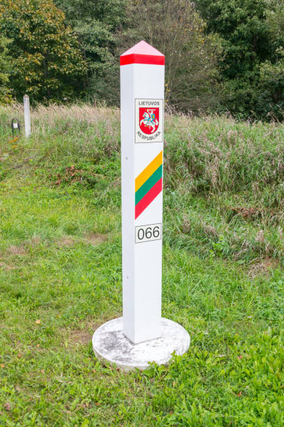 istock Lithuanian Territorial sign. Border post on the border between Poland and Lithuania. 1061004158