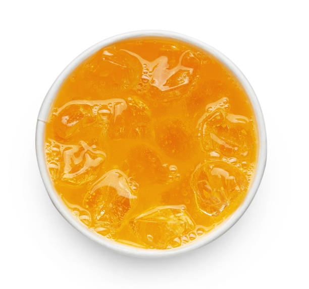 Orange soda drink in take away plastic cup isolated on white background