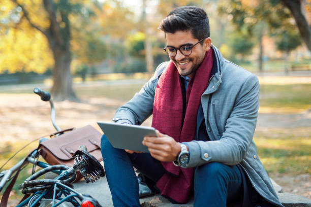 istock Businessman reading book on tablet 1061005316