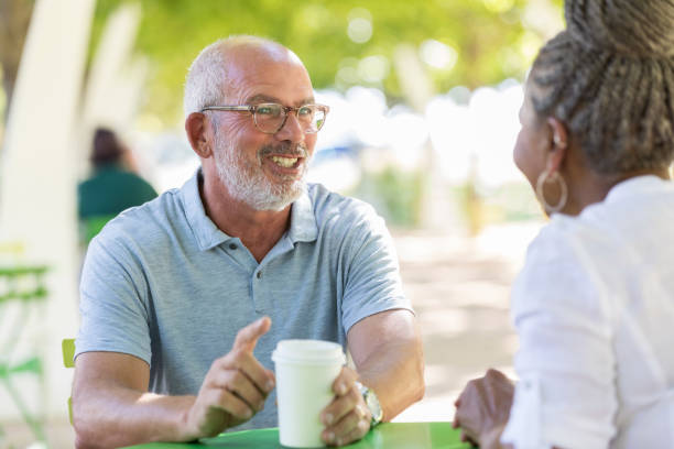 istock During a lunch break, two business partners talk over coffee 1061006554