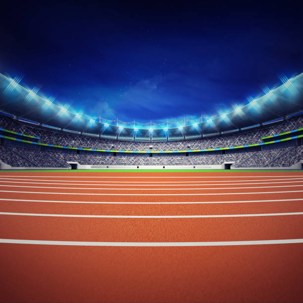 istock athletics stadium with track at general front night view 1061009942