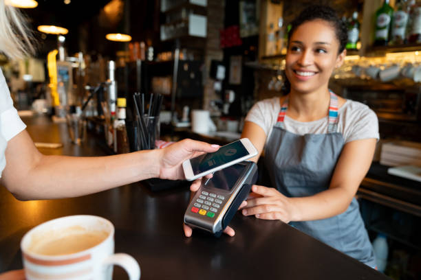 istock Customer making a contactless payment at a cafe 1061010112