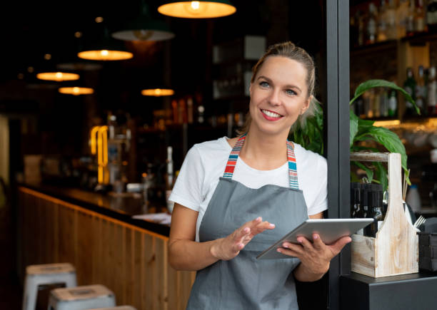 istock Business woman working at a cafe using a tablet computer 1061010234