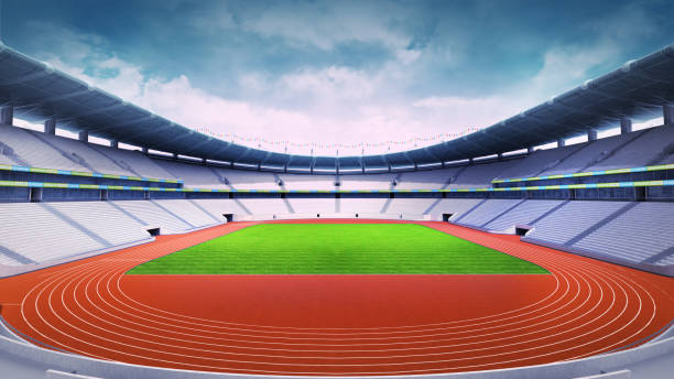 istock empty athletics stadium with track and grass field at front day view 1061010292