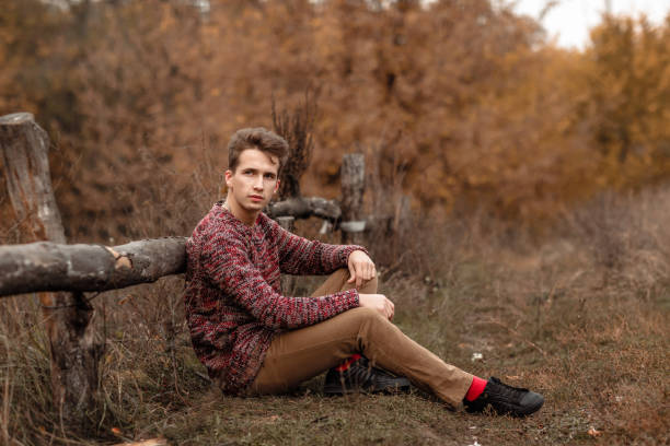 istock Handsome young guy in nature on an autumn day 1061011070