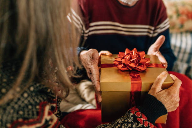 istock Elderly couple exchanging gifts 1061011218