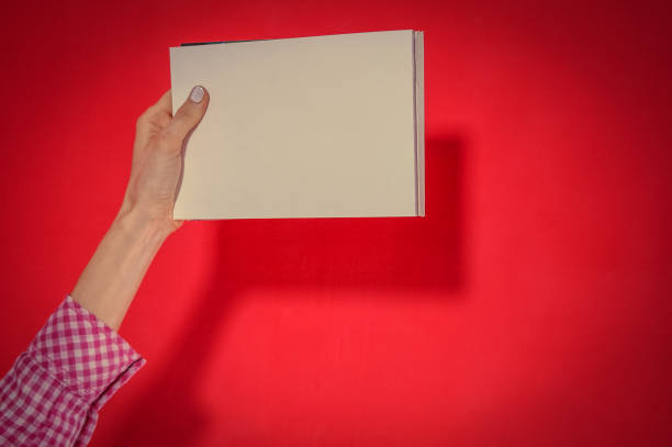 istock Woman hand holding blank paper 1061019078