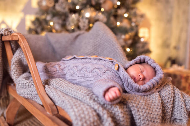 istock Baby boy sleeping under the Christmas tree on New Year's Eve 1061020078