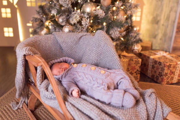 istock Baby boy sleeping under the Christmas tree on New Year's Eve 1061021304