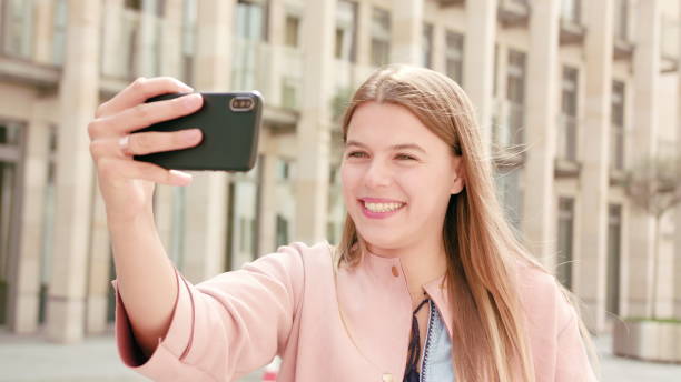 istock Young Lady Chatting on the Phone in Town 1061024706