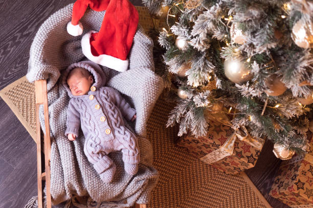 istock Baby boy sleeping under the Christmas tree on New Year's Eve 1061024800