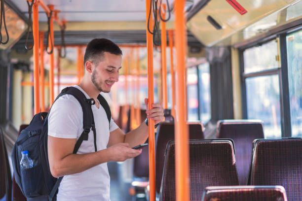 istock Young Man in the Bus with Smart Phone 1061026698