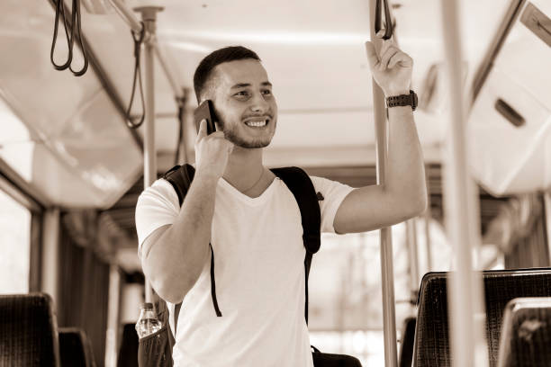 istock Young Man in the Bus with Smart Phone 1061026716