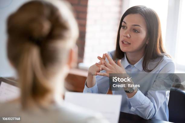 Confident Focused Businesswoman Speaking To People At Business Negotiations Stock Photo - Download Image Now