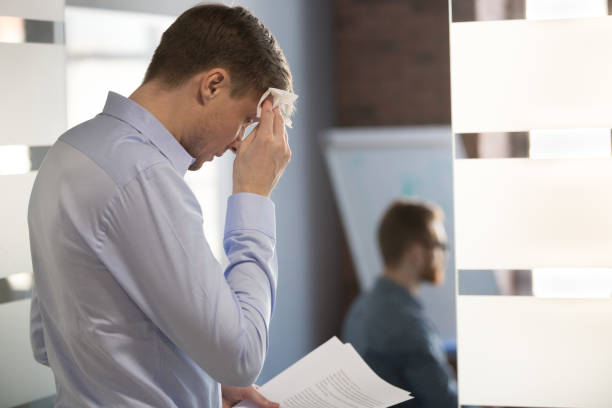 nervous sweaty speaker preparing speech wiping wet forehead with handkerchief - white collar worker fear businessman business imagens e fotografias de stock