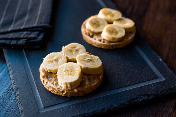 istock Bulgur Rice Cakes with Sliced Bananas and Peanut Butter / Round Crackers. 1061028332