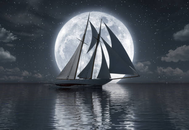 istock Sailboat on the sea in front of full moon 1061033092
