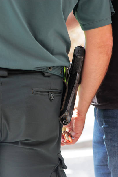 istock policeman wearing a pistol 1061035008