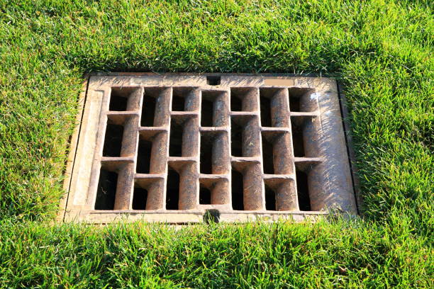 istock Metallic square drainage in the lawn 1061035114