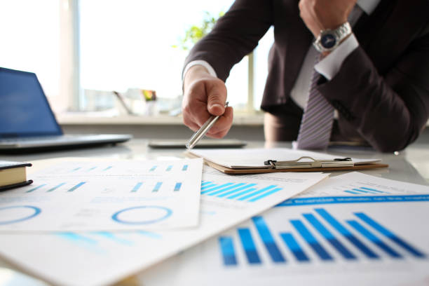 istock Male arm point silver pen at important paper 1061036268